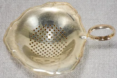 English two-piece tea strainer from the 1930's - silver plate